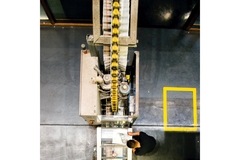Image aerial view of man working on a printing press in a packaging factory