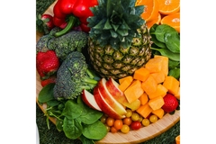 Image Fruit and vegetables are on a plate.