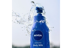 Image water splashing on Nivea body lotion bottle.