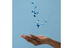 Magnesium minerals supplements in hand