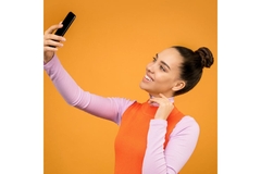 smiling woman taking selfie