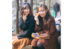 Two women eating watermelon