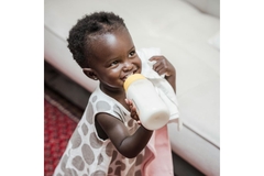 Image Infant drinking infant formula