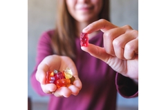 Gummies in hand