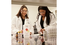Image Two female scientists working in a lab.