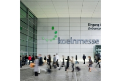 Image Visitors entering trade show building.