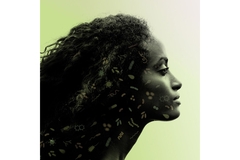 Image The profile of someone in front of a green background.