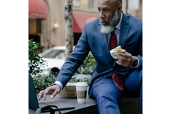 Businessman eating low-fiber food