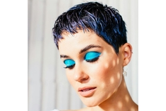 woman wearing makeup poses