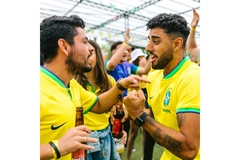 Image Men drinking beer at a soccer game