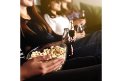 Group of friends with popcorn and no-calorie sweetened drinks.