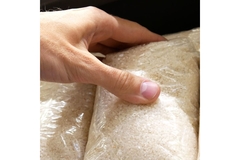 Holding rice packaging.