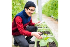 Image Farmer doing research on his sustainable plants.