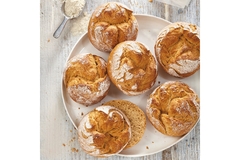 Image Six pieces of bun with white flour on top.