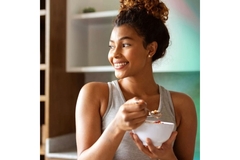 Image Woman eating nutritional dairy and fruit