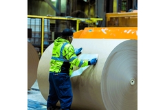 Image international paper's worker rolls paper roll