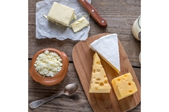 Cheeses on a kitchen table.