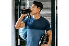 Image Man consuming a dietary supplement