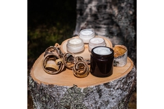 Image Cosmetic products on a birch tree stump