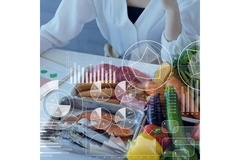 Image Person in a white coat with lots of food in front of them, analyzing their content.