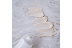 Image Smear of face mask on a marble counter.