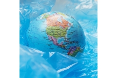 Image blue plastic around a globe