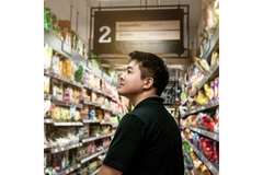 Image Asian man in supermarket.