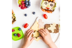 Image Child reaches for diverse food options