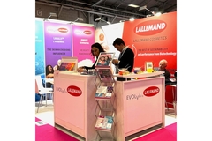 Image Two people at a booth in In-cosmetics.
