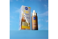 Image Nivea Q10 Dual Action Serum in front of a fake sky.