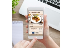 Image female hand holding white phone with food app delivery on screen
