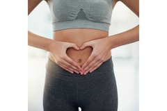 Image Hand heart over tummy.