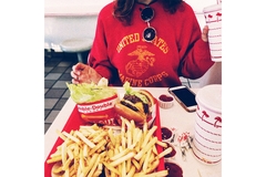 Woman eating fast food.