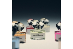 Image H&M Beauty's new perfume range on a table together.