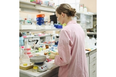 Image Researcher working on vitamin D and cancer link in a lab.