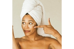 Image Woman applying face cream