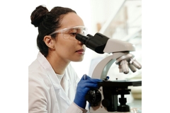 Image Scientist looking at a microscope