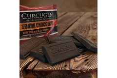 Image Curcugen chocolate pieces and packaging on a table.