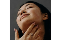 Image Woman applying face cream