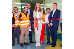 Image Alpla team cutting ribbon at new facility.
