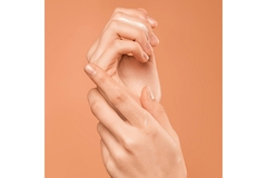 Image Closeup of hands applying hand cream