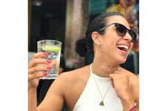 Woman drinks carbonated functional ingredient water