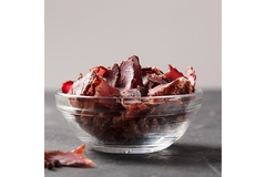 Image Jerky beef in a glass bowl.