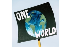 Image poster of globe saying "one world"