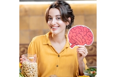 Image Woman holding brain image brain health