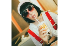 woman drinking from a starbucks cup