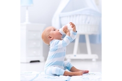 Image Baby drinks milk