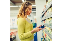 A woman checking labels.