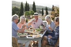 Senior people eating a Mediterranean diet outside.