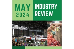 Image A graphic which reads "May in Review" and has a picture of a crowd at Vitafoods Europe next to a person buying a peach at a fruit stand.